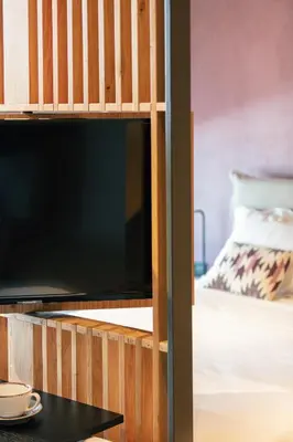 a bunk bed with a flat screen tv in a room at Souda Plaza Collection in Souda