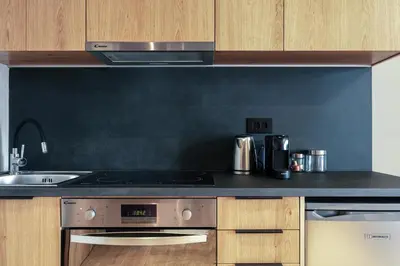 a kitchen with a stove and a sink at Souda Plaza Collection in Souda