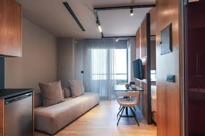 a living room with a couch and a table at Souda Plaza Collection in Souda