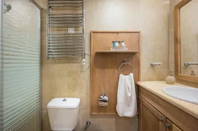 a bathroom with a toilet and a sink at Pasifai Residence - Chania old town in Chania Town