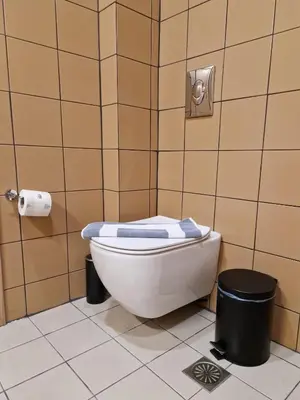 a bathroom with a toilet with a towel on it at Mosaic Apartments in Chania Town