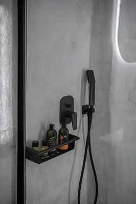 a black phone is hanging on a wall at Malmáki, a street view apartment in Chania Town