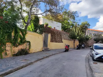a motorcycle parked on the side of a street at Dominic Central Venetian Castle Old Port Apartment in Chania Town