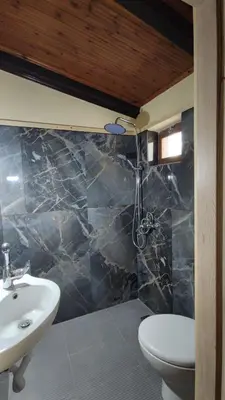 a bathroom with a sink and a toilet and a shower at Dominic Central Venetian Castle Old Port Apartment in Chania Town