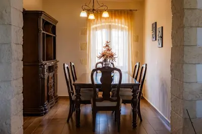 a dining room with a table and chairs and a window at Giovanta Villa in Kondomari