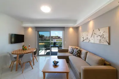 a living room with a couch and a table at Sunshine Suite Junior in Chania Town