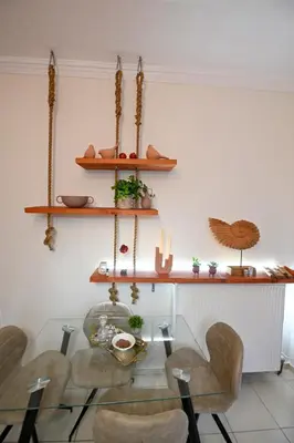 a dining room with a glass table and chairs at Popi's House in Chania Town