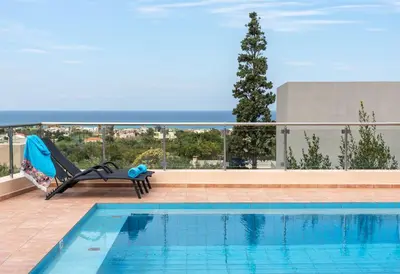 a swimming pool with a view of the ocean at Villa Stratianna by PosarelliVillas in Módhion