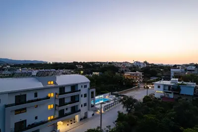 a view of a city at sunset from a building at Aurora apartments in Chania Town