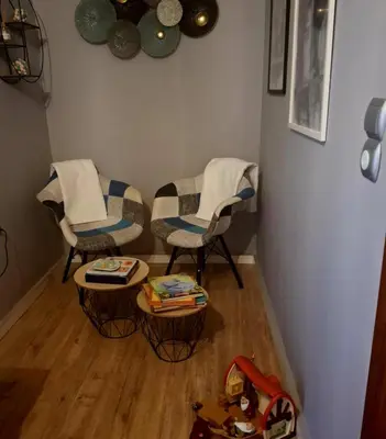 two chairs and a table in a living room at Art and view-studio in Kounoupidhianá