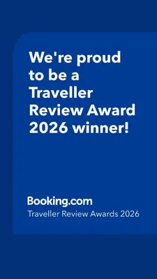 a blue sign that says were proud to be a traveller reviewagency winner at Art and view-studio in Kounoupidhianá