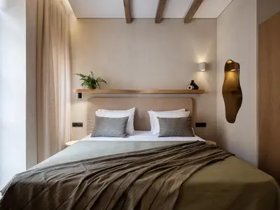a bedroom with a large bed with white sheets and pillows at Casa Modiano Boutique in Chania Town