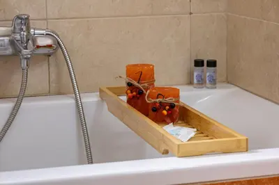 a bath tub with a tray with fruit on it at Vasiliki house in Daratso