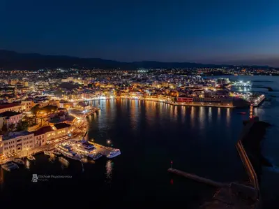 a view of a city at night at Vasiliki house in Daratso