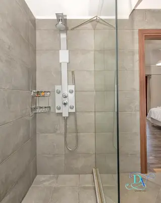 a bathroom with a shower with a glass door at Apokoronas Views Villa in Néon Khoríon
