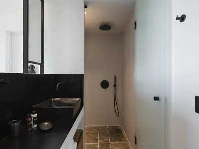 a bathroom with a sink and a shower at Brand new Villa Eleftheria BY APOKORONAS-VILLAS in Plaka