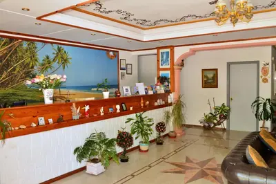a lobby with a waiting room with plants at Sun City in Kato Daratso