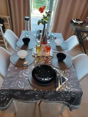 a dining room table with a blue table cloth and a table at Mini Villa Kalathas in Kalathas