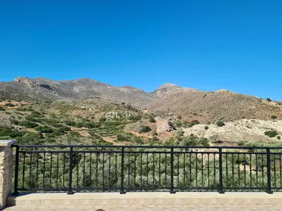 a balcony with a view of the mountains at Enastron vacation house in Kissamos