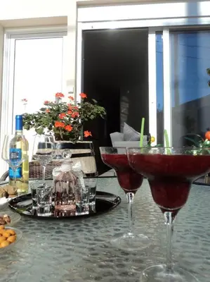 two wine glasses sitting on top of a table at The Getaway in Agia Marina Nea Kydonias