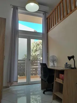 an office with a desk and a window with a view at The Getaway in Agia Marina Nea Kydonias
