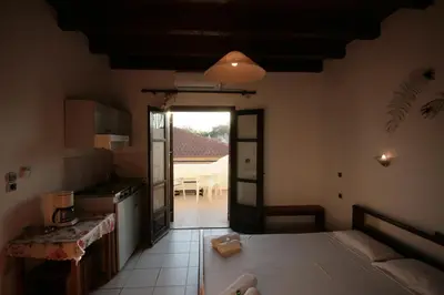 a kitchen with a table and a counter top at Chania Rooms in Chania Town