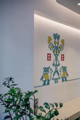 a painting of a snowflake on a wall with a plant at Arkadi Hotel in Chania Town