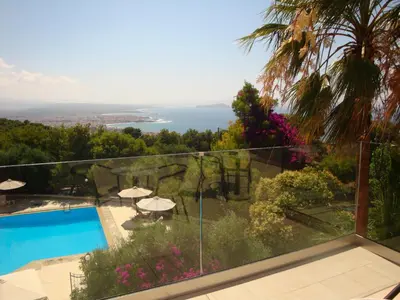 a view from the balcony of a house with a swimming pool at Monte Vardia in Chania Town
