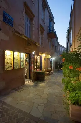 an alley with a building with lights on it at Pension Eva in Chania Town