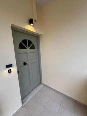 a door in the corner of a room at Mediterranean Sea Top Floor in Palaiochóra