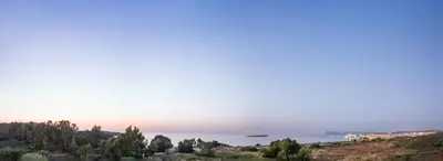 a view of the ocean from a hill at Sea View Hotel & Apartments in Kato Daratso