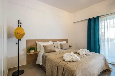 a bedroom with two beds with towels on them at Annet in Chania Town