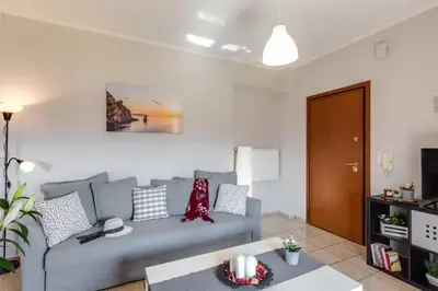a living room with a couch and a table at Stema City Apartment in Chania Town