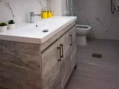 a bathroom with a sink and a toilet at Charming apartment in Halepa! in Chania Town
