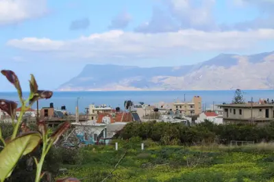 a city with a view of the ocean and mountains at Kallia's Modern Apartment in Kissamos