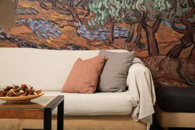 a living room with a white couch and a table at Halepa Luxury Apartments in Chania Town