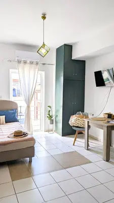 a living room with a couch and a table at Beautiful apartment in Chania in Chania Town