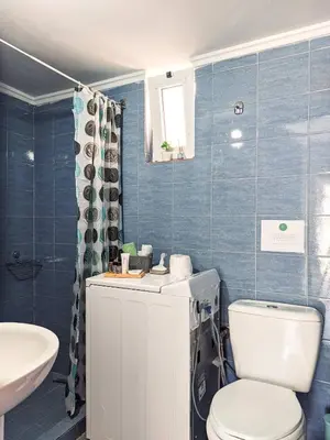 a bathroom with a toilet and a sink at Beautiful apartment in Chania in Chania Town
