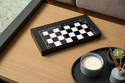 a chess board and a cup of coffee on a table at 2 bd downtown home with private parking 400 meters walk to the beach in Chania Town