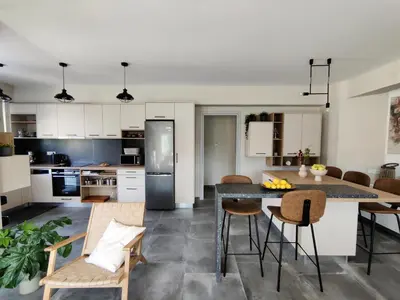 a kitchen and dining room with a table and chairs at Thelma and Louise house in Mourniaí
