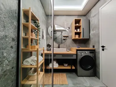 a bathroom with a sink and a washing machine at Thelma and Louise house in Mourniaí