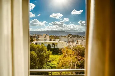 a view of a city from a window at Porfyra Suite 2 in Chania Town