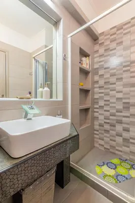 a bathroom with a sink and a mirror at Beachfront villa Agia Marina in Stalos