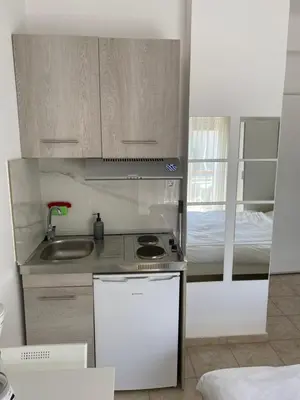 a small kitchen with a sink and a stove at maren apartment in Chania Town