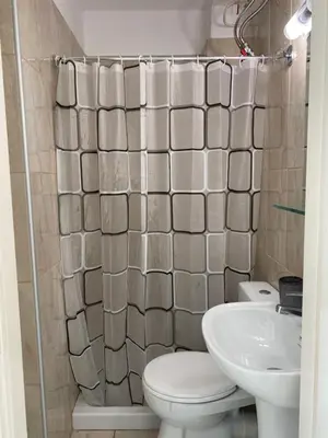 a bathroom with a toilet and a sink at maren apartment in Chania Town