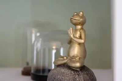 a statue of a frog sitting on top of a jar at Blue Port in Chania in Souda