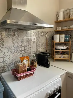 a kitchen counter with a basket of food on it at DOLONAS Cosy House in Aliyoí