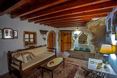 a living room with a couch and a table at Villa Polirinia in Kissamos