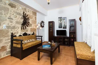 a living room with a couch and a table at Falasarna's Sunset Home in Falasarna