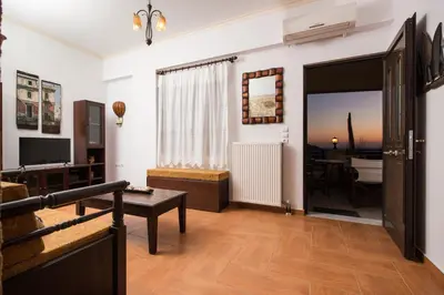 a living room with a door leading to a dining room at Falasarna's Sunset Home in Falasarna